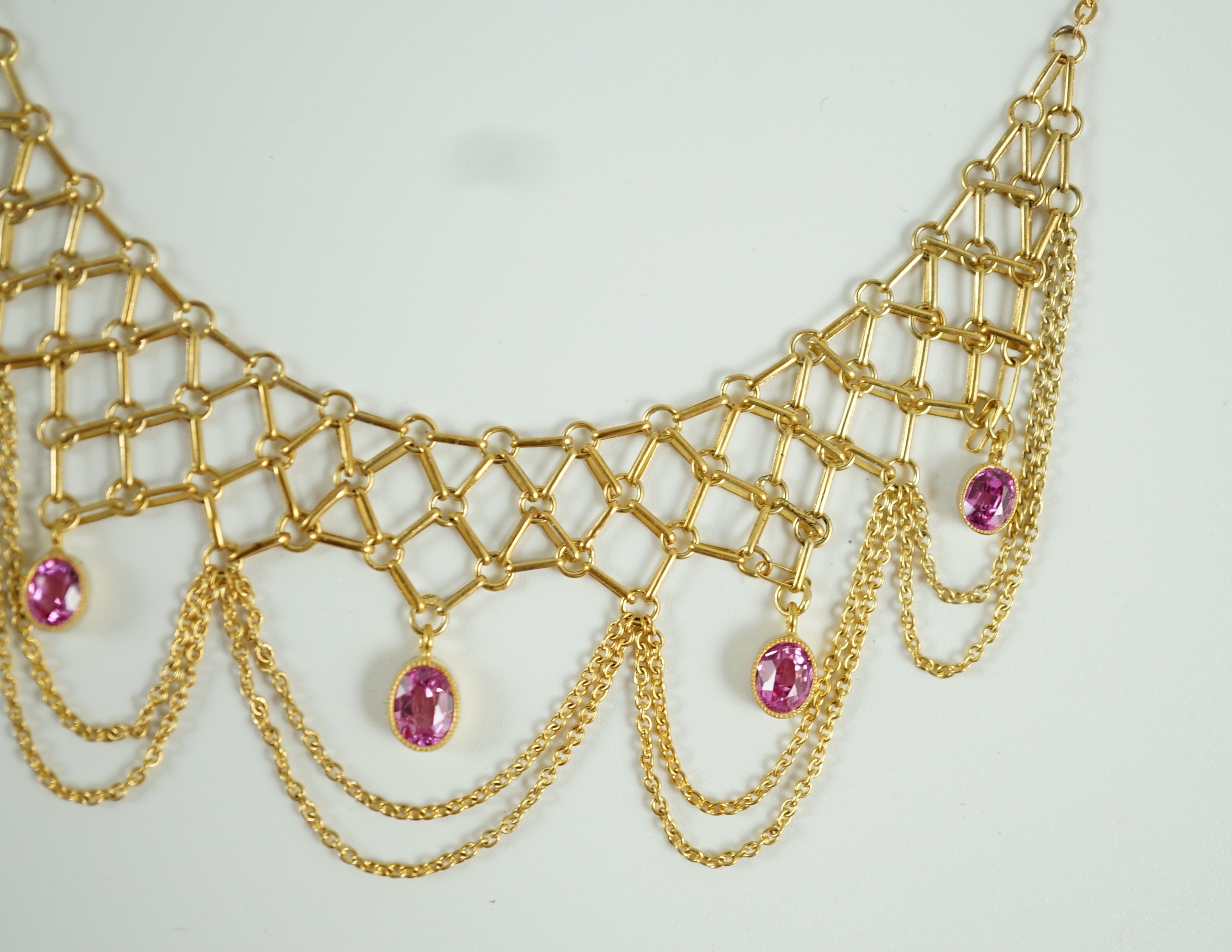 A 20th century 14k gold and five stone oval cut pink topaz set drop fringe necklace
